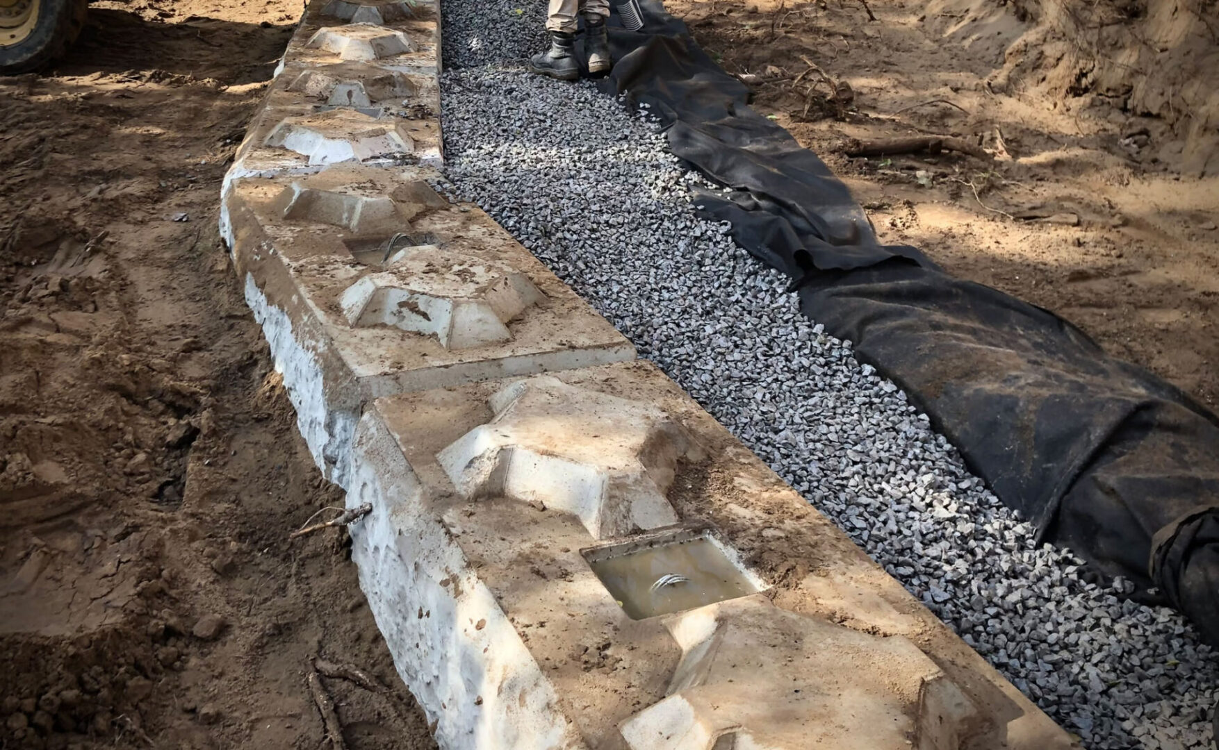 Concrete wall and gravel path construction